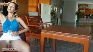 Woman without panties under a skirt in a hotel