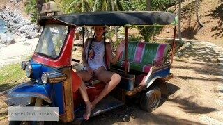 Beauty without panties driving a beach car