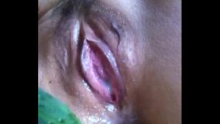 chinese milf masturbating by using a cuke