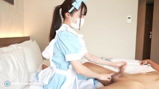 Japanese girl gives a guy a hand job cosplayed as a maid